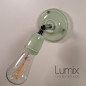 Lampe applique murale orientable en porcelaine vert pastel et métal chromé Lampe applique murale orientable en porcelaine vert pastel et métal chromé