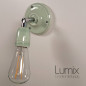 Lampe applique murale orientable en porcelaine vert pastel et métal chromé Lampe applique murale orientable en porcelaine vert pastel et métal chromé